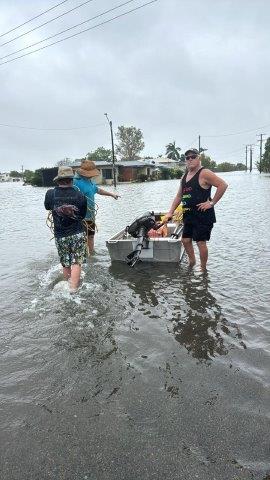 Ingham Family Medical Practice staff use a boat during the flood crisis