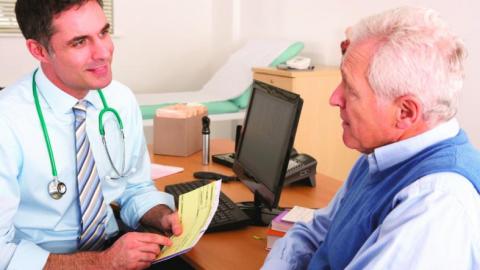 GP consultation with older man