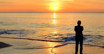 Mental health-silhouette man on beach