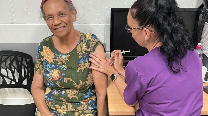 A patient receives a COVID-19 vaccine at Cairns West Medical Centre