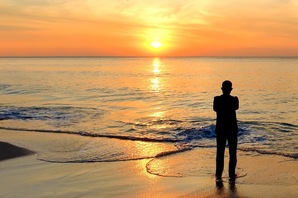 Mental health-silhouette man on beach