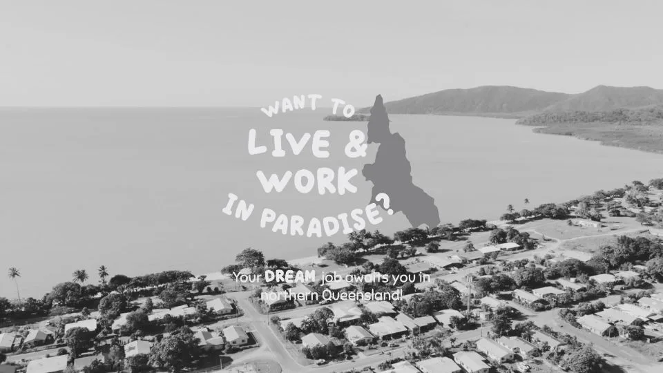 L:ive and work in paradise logo on top of landscape image of Yarrabah community