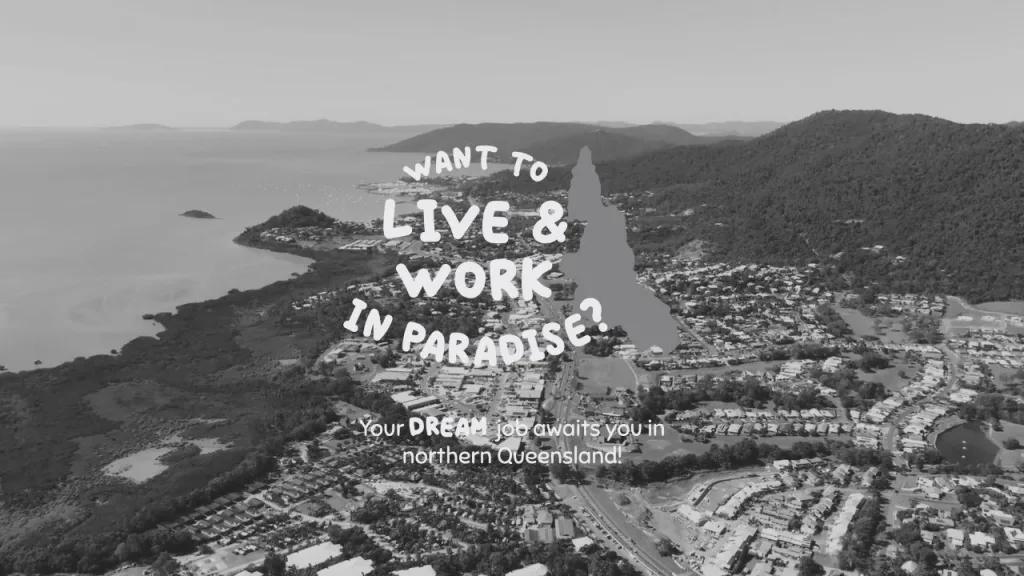 Live and work in paradise logo on top of an image of Airlie beach