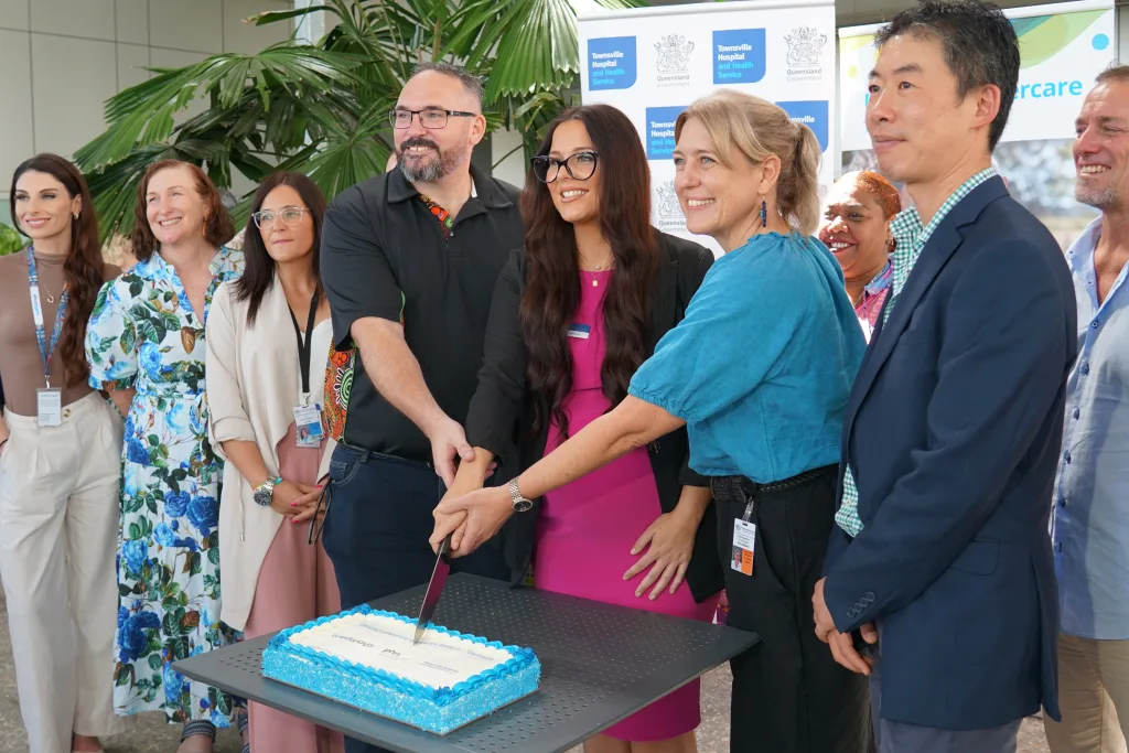 Partners of Townsville Universal Aftercare launch cake cutting celebration