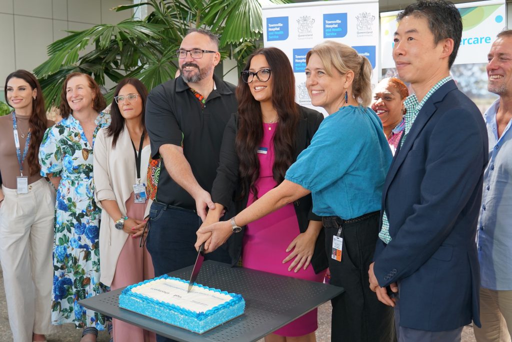 Partners of Townsville Universal Aftercare launch cake cutting celebration