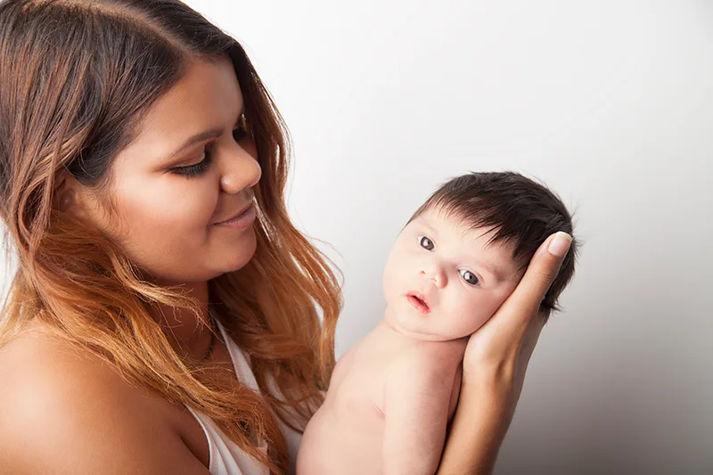 Mother holding her newborn baby